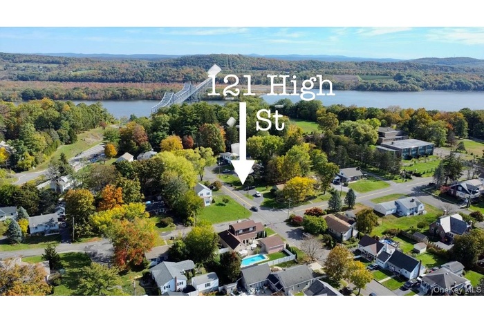 View of property location with a large body of water and nearby suburban area