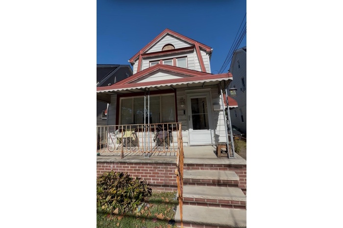 View of front facade featuring covered porch