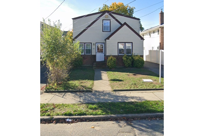 Bungalow with brick siding
