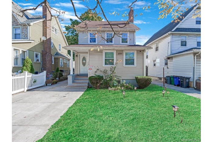 View of front of property with a chimney