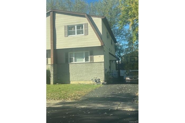View of front of house featuring stone siding