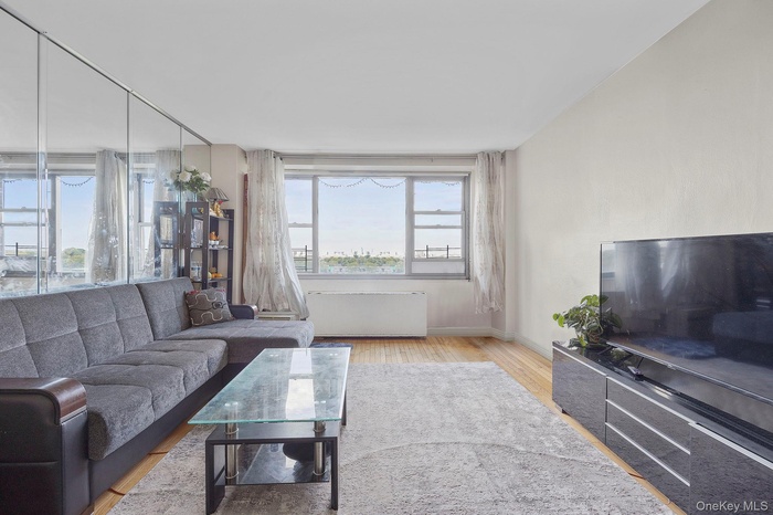 Living room with baseboards and wood finished floors