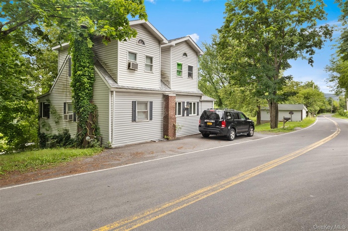 View of front facade featuring cooling unit