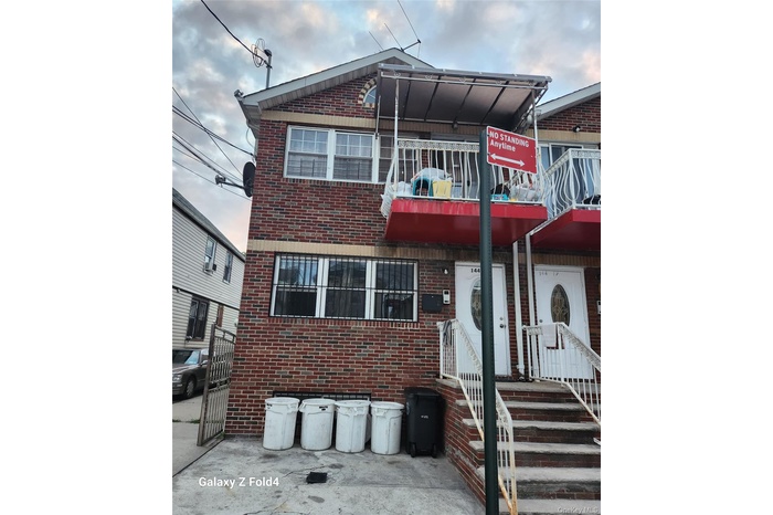 View of front of property featuring brick siding