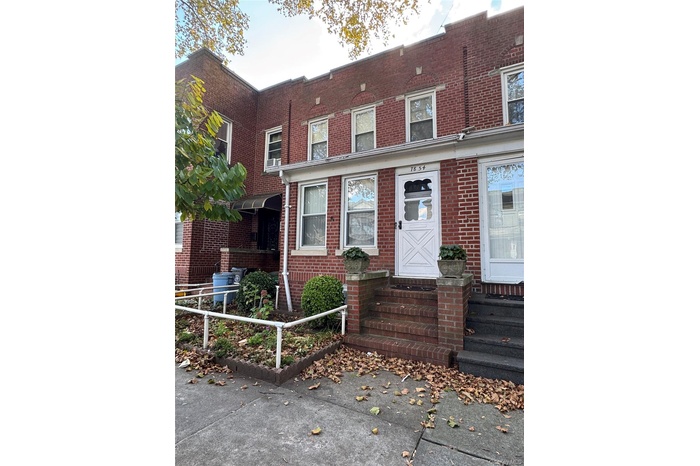 Traditional-style house featuring brick siding