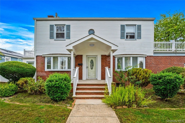 View of front of home with brick siding