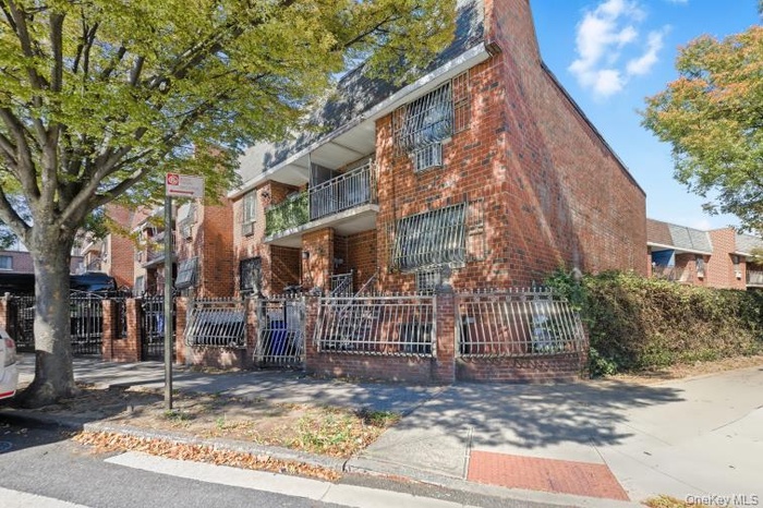 View of property featuring a fenced front yard