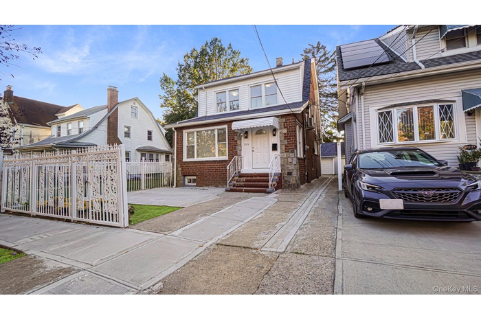 View of front of house featuring brick siding