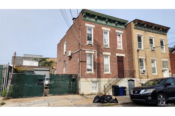 View of property featuring stairs