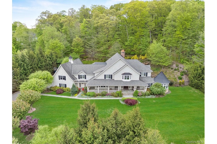 View of subject property featuring a forest