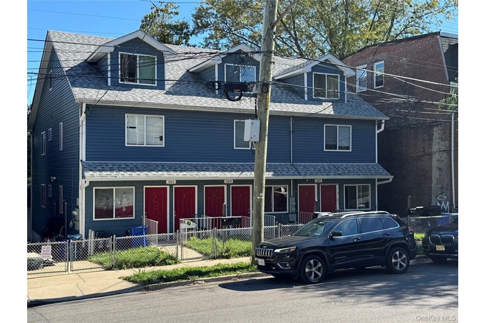 View of front of property featuring a fenced front yard.