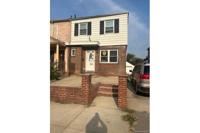 View of front of property with brick siding