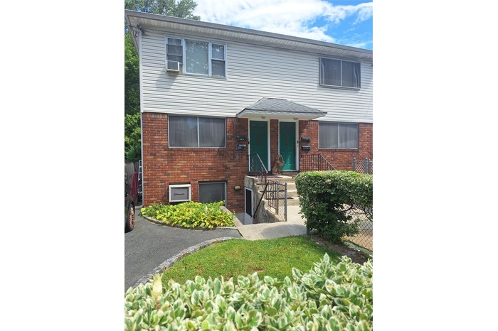 View of front of home with brick siding