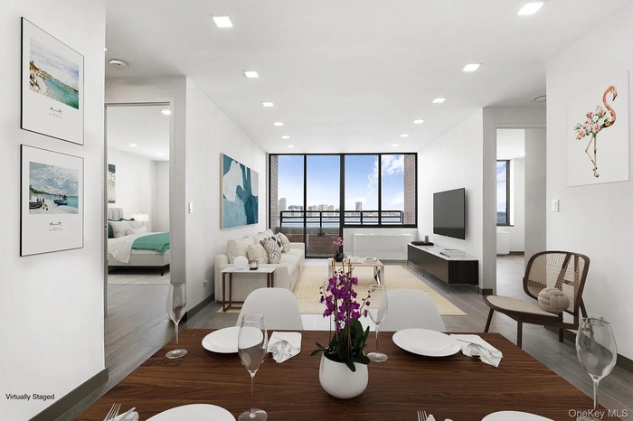 Dining room featuring recessed lighting, dark wood-type flooring, and expansive windows