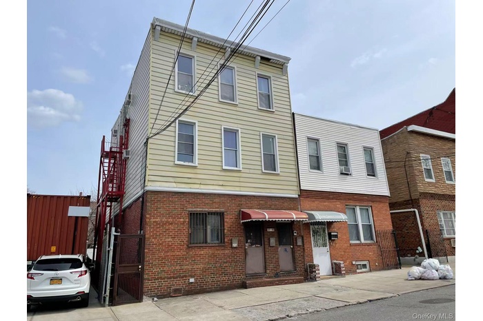 View of front of property with brick siding