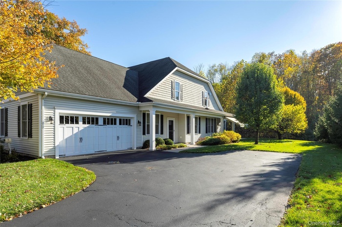 View of front of house with two car garage.
