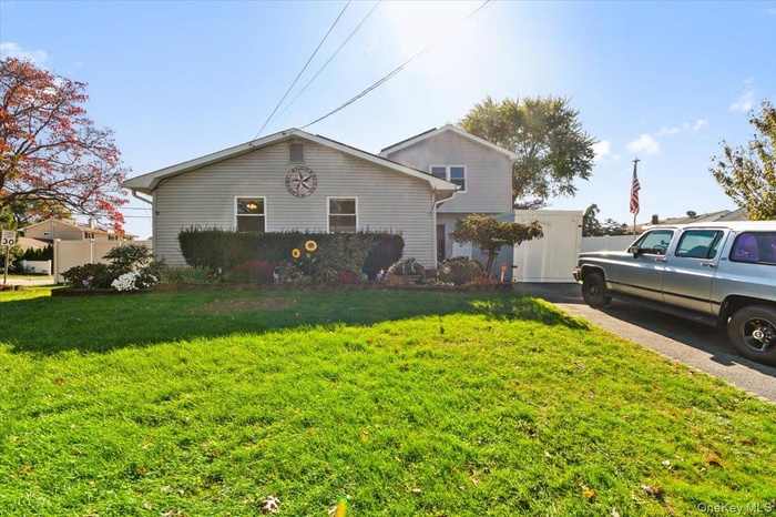 View of front of house with a front yard