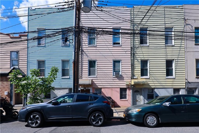 View of side of property featuring cooling unit