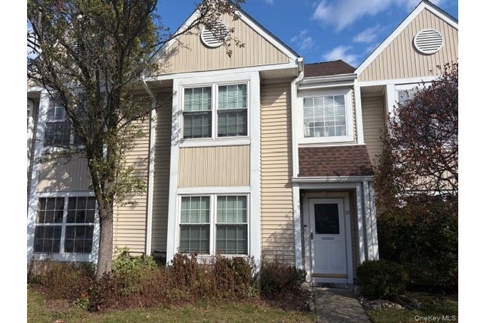 View of front facade featuring board and batten siding