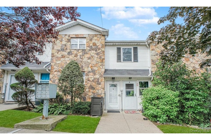 View of front of property featuring stone siding