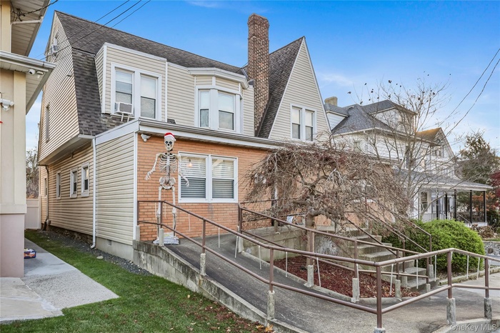 View of front of house with a chimney