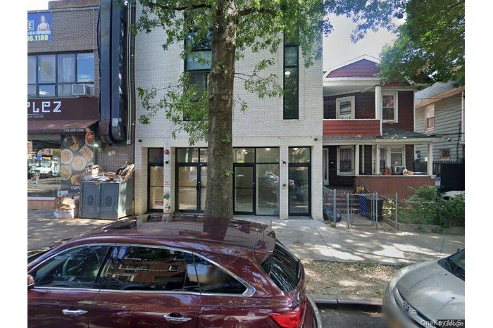 View of front of property with brick siding