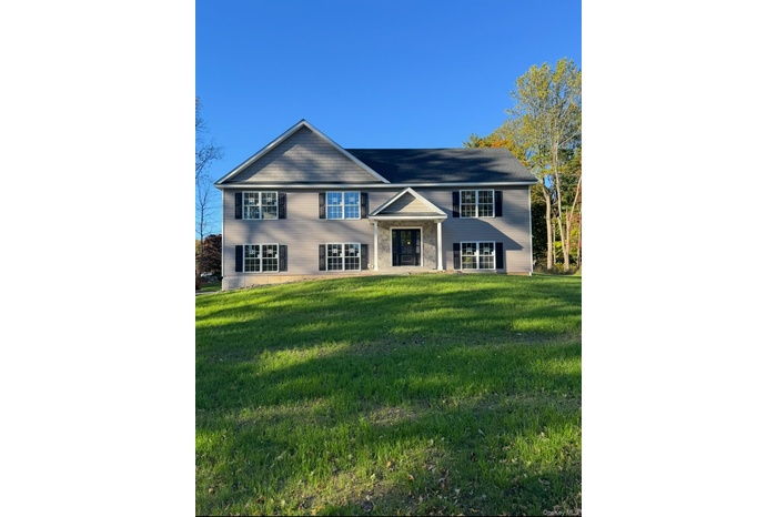 View of front of home featuring a front yard