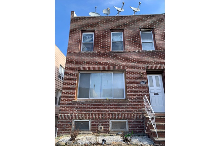 View of front of house featuring brick siding