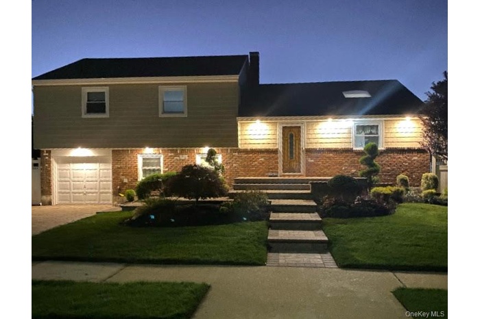 Split level home with new siding and new windows