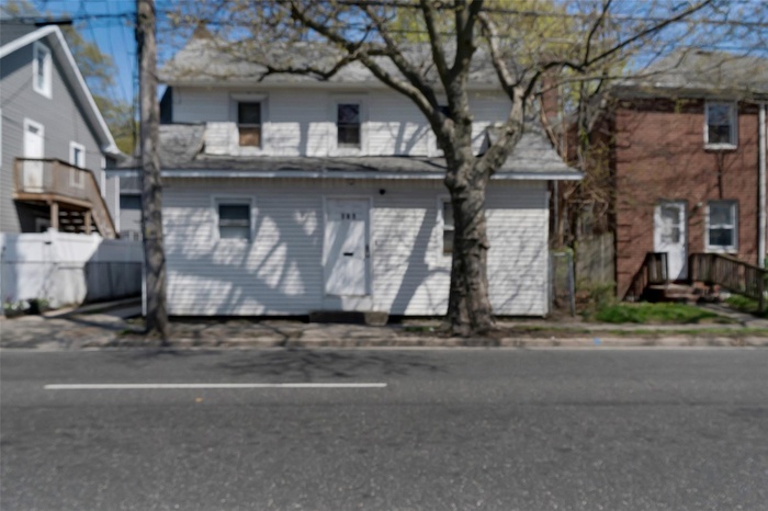 View of front of house with fence