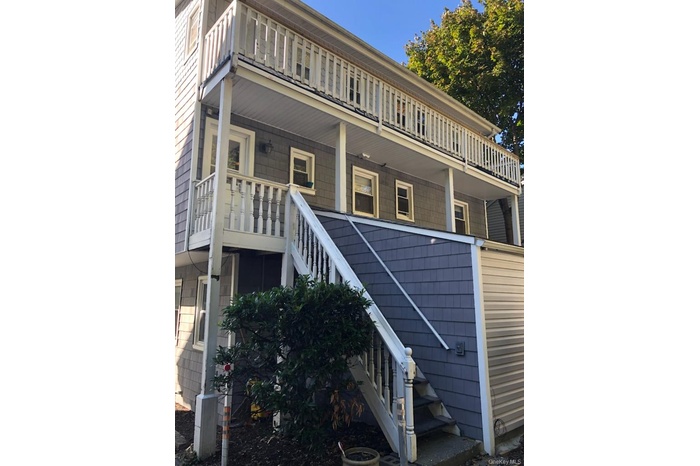 View of building exterior featuring stairs