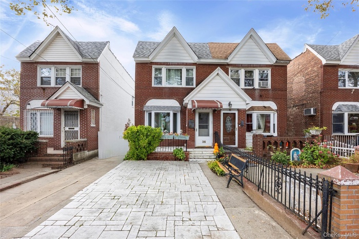 View of front of property featuring brick siding