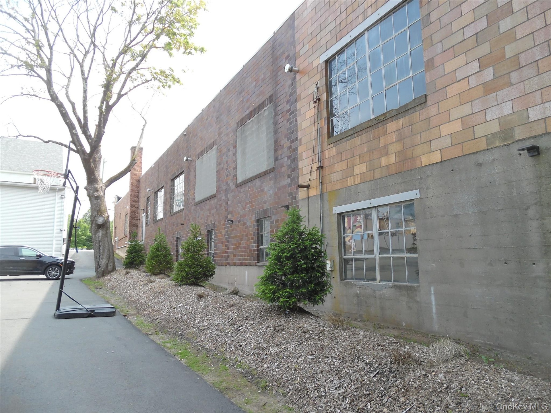View of side of home featuring brick siding