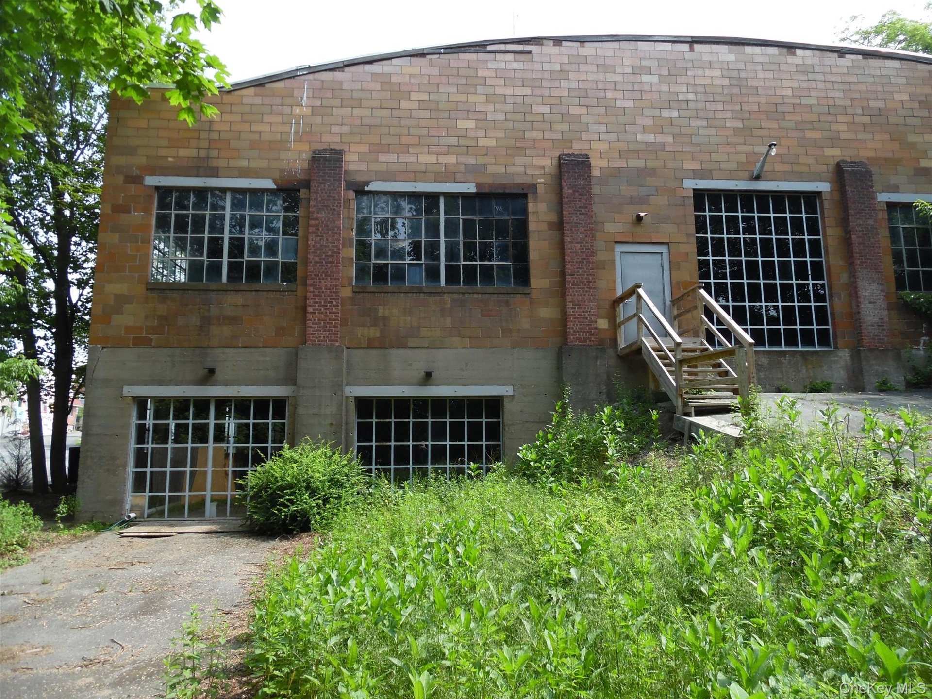Back of building featuring brick siding