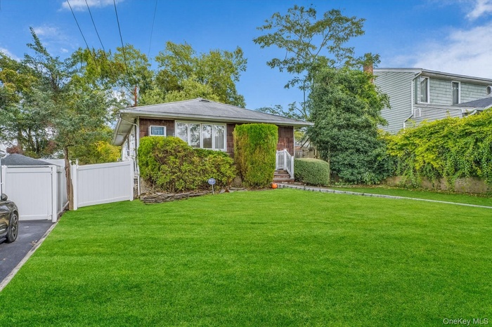 View of front of house with a gate