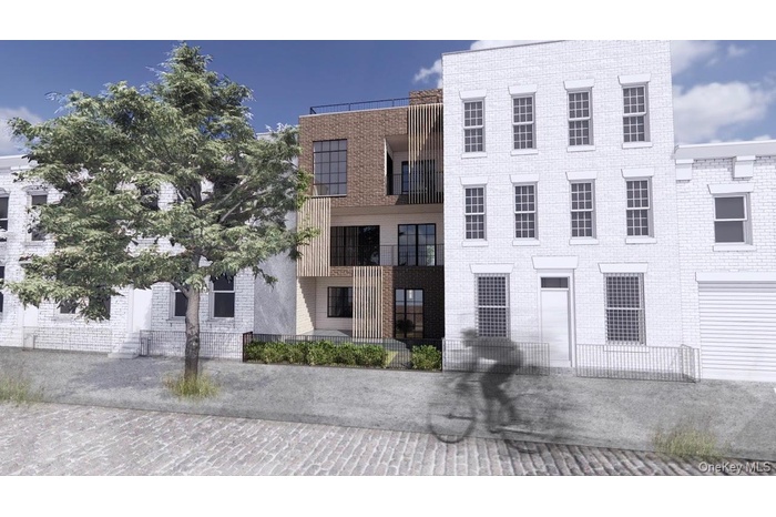 View of front facade featuring brick siding