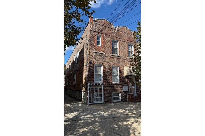View of left side of property with brick siding