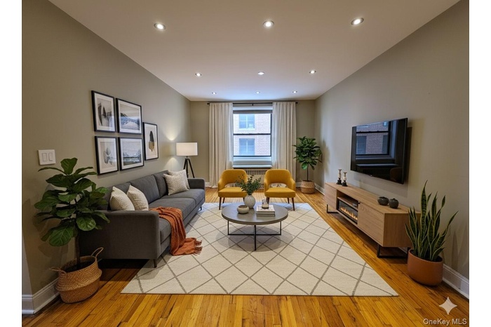 Living room with light wood finished floors and recessed lighting