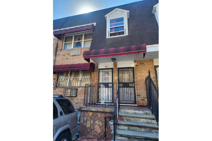 View of front of property featuring brick siding