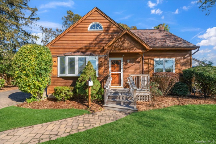 Rustic home featuring a front lawn and a chimney