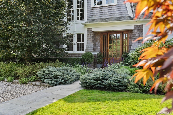 Entrance to property featuring a lawn