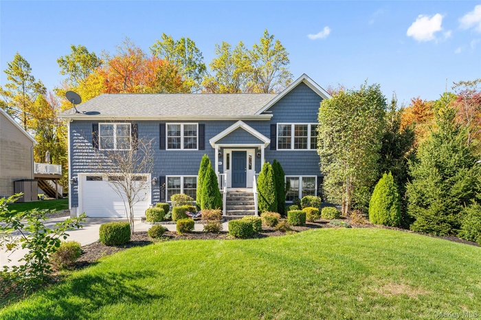 Stunning curb appeal to this Raised Ranch