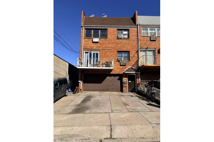 View of front of house with a balcony, brick siding, concrete driveway, a shingled roof, and an attached garage