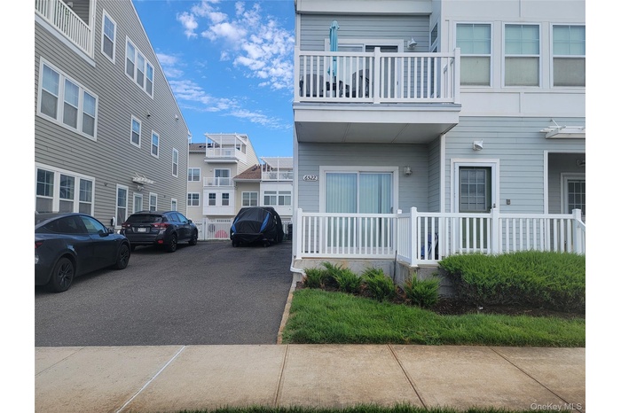 View of side of property featuring a balcony