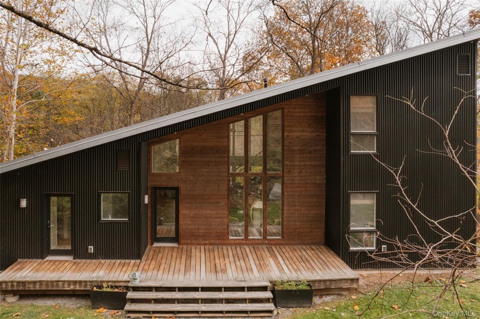 Back of house featuring a deck