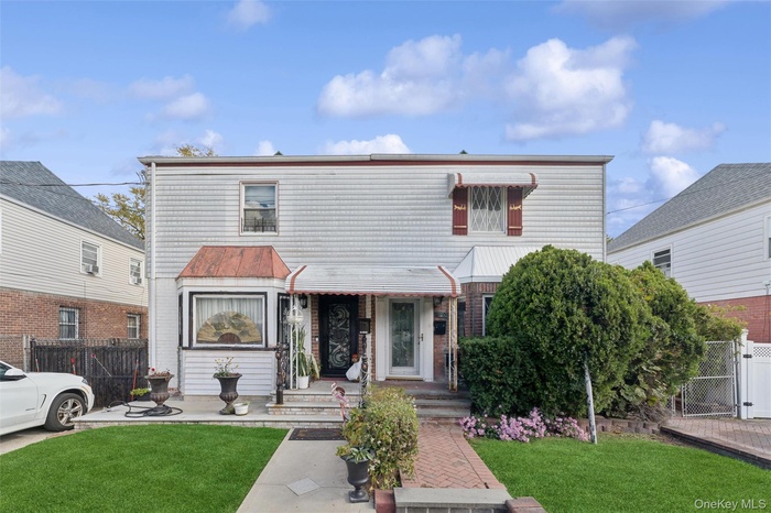 Traditional-style house featuring a gate