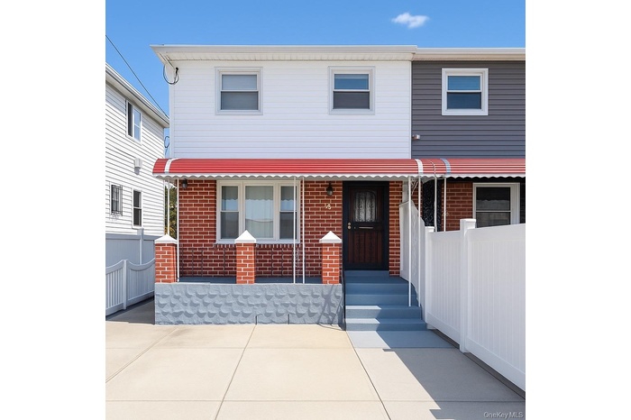 View of front of property with brick siding
