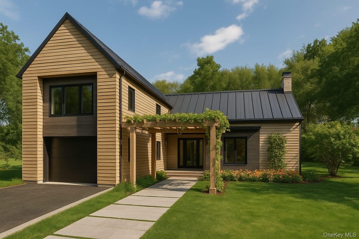 Contemporary home with a garage, a front lawn, driveway, a pergola, and a metal roof