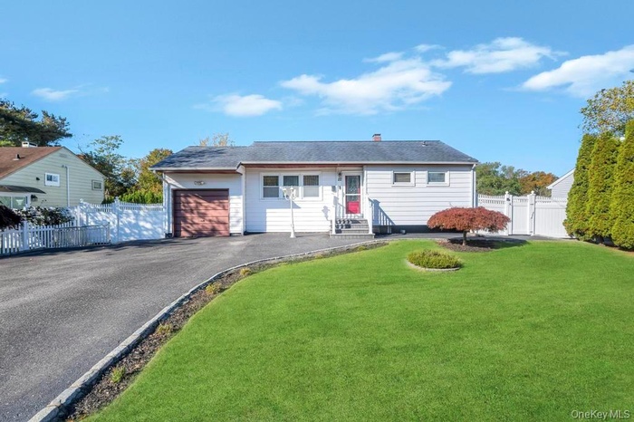 Ranch-style home with a Large driveway