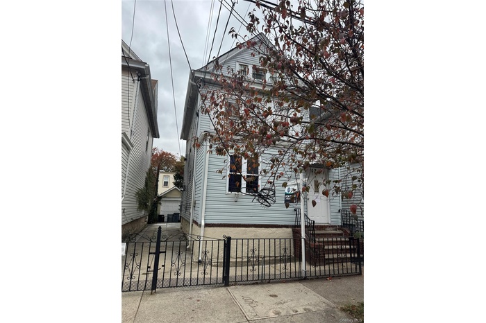 View of home's exterior with a gate and a fenced front yard